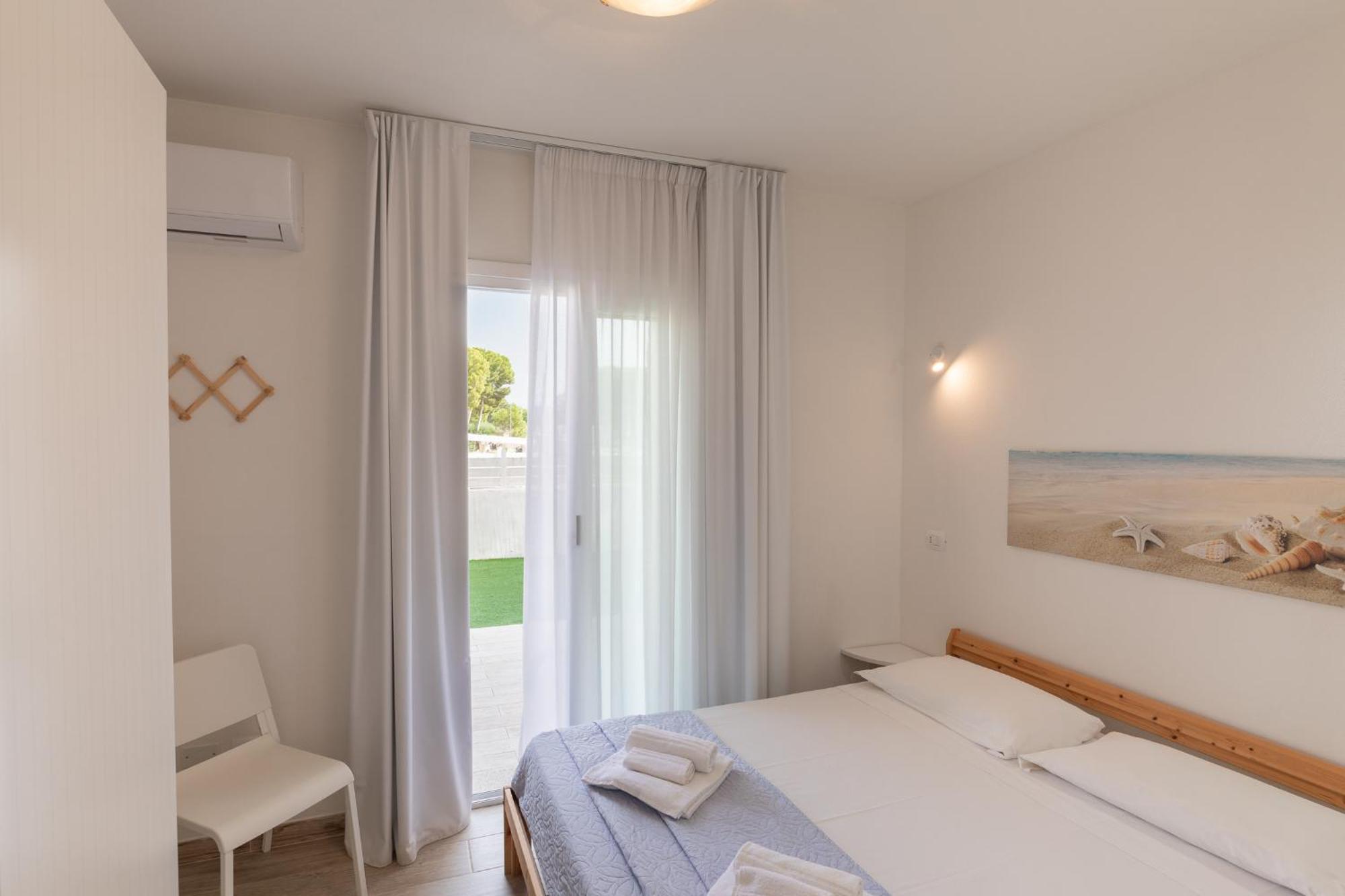 Case Vacanze "Bianco Mare" Porto Pino Bilik gambar