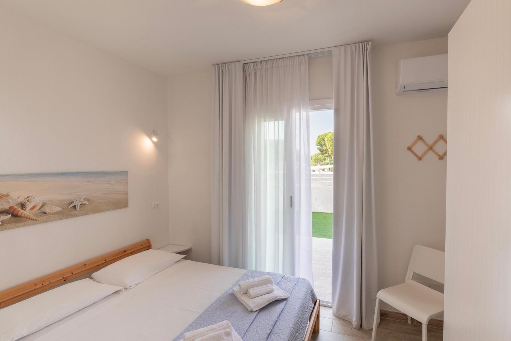 Case Vacanze "Bianco Mare" Porto Pino Bilik gambar